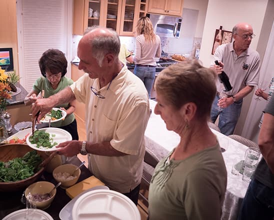 Family serving dinner at home