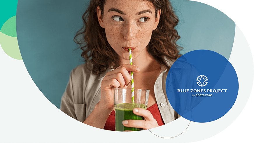 Woman drinking a green smoothie