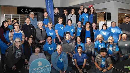 Group of volunteers in Blue Zones Project shirts.